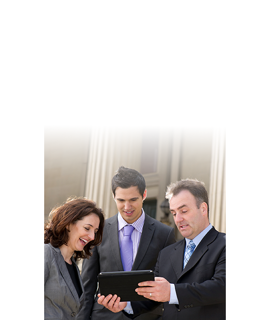 Three goverment employees working together on a tablet.