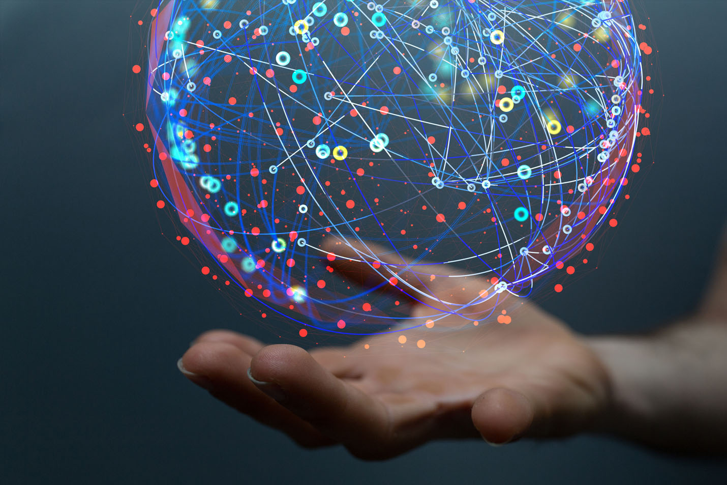 A digital globe floating on a hand