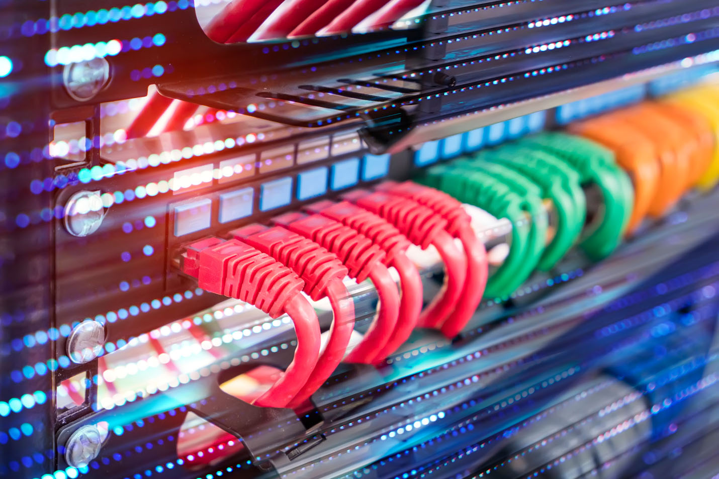 Ethernet cords plugged into a network server